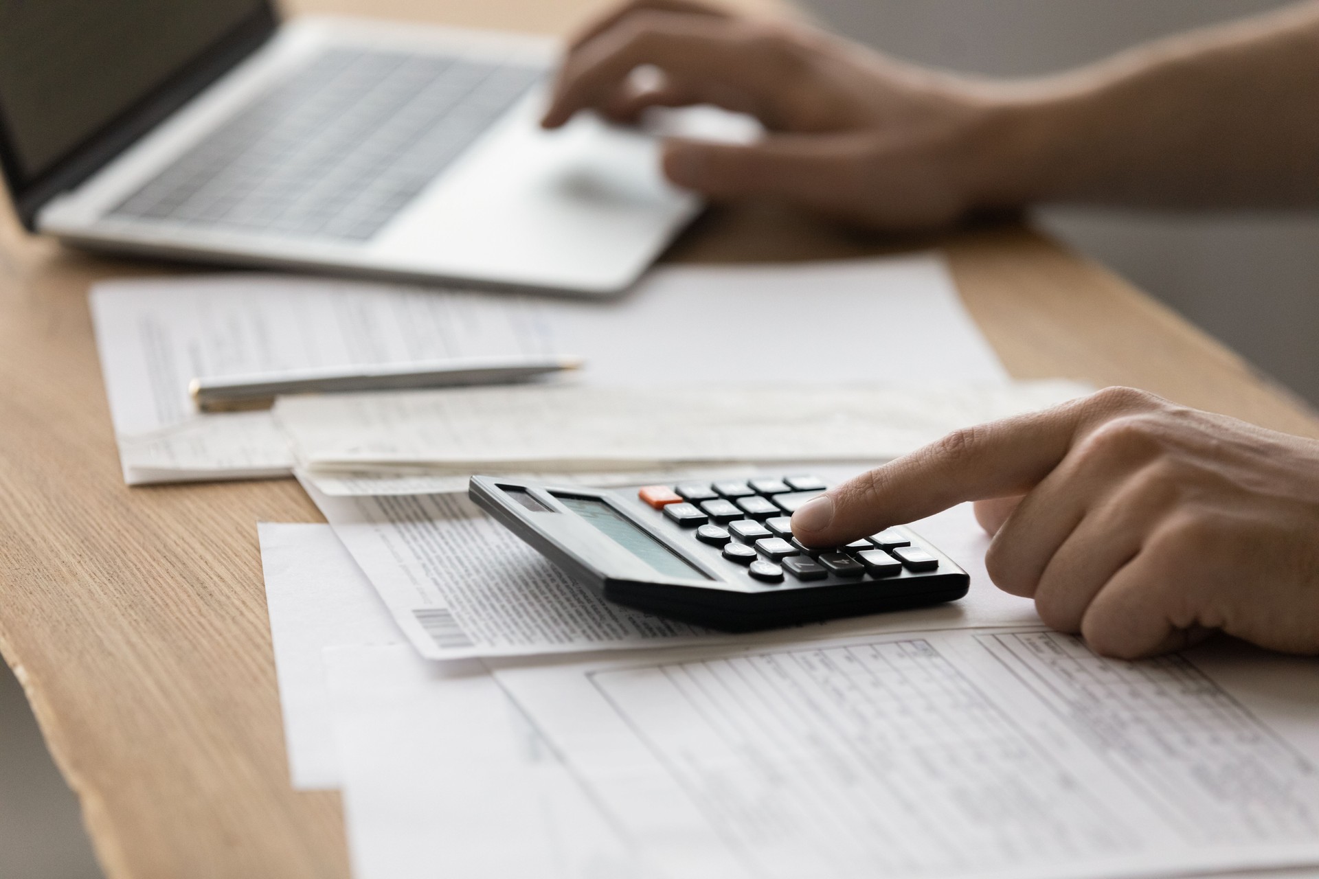 Young male accounting clerk filling in tax declaration electronic form